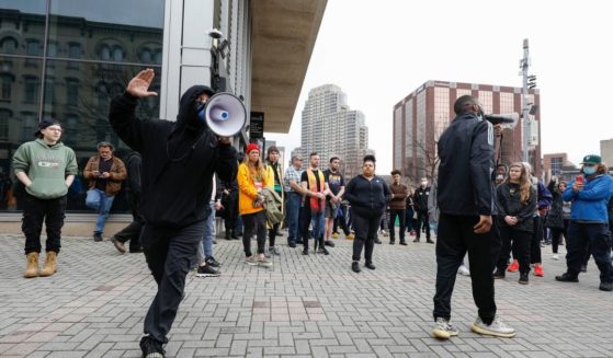 People protest the police shooting of Patrick Lyoya on Wednesday in Grand Rapids, Michigan.