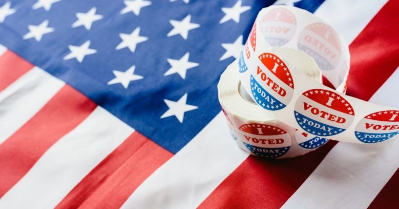 Voting stickers are seen in the above stock image.