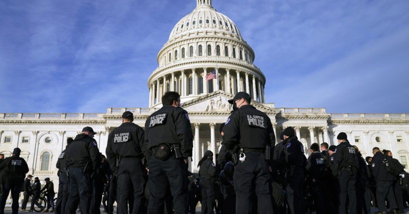 A large group of US Capitol Police are seen in a file photo from January. A Capitol Police officer fired a gun inside a break room in a House office building on Tuesday and was promptly suspended.