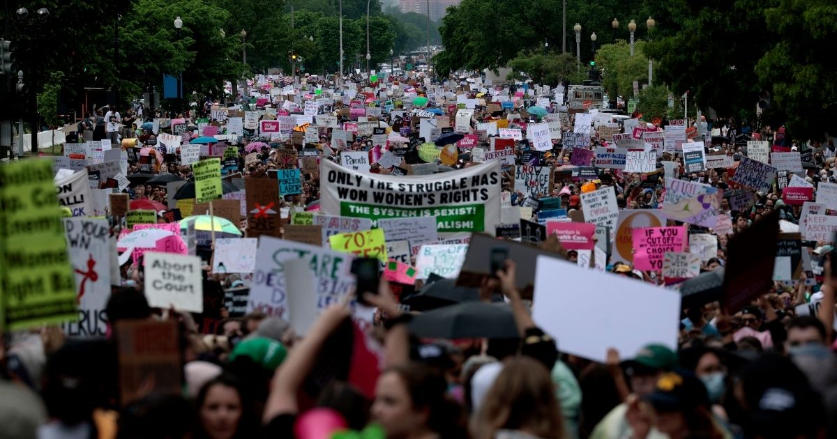 Pro-abortion protesters march down Constitution Avenue for the Bans Off Our Bodies march in Washington, D.C., on Saturday.
