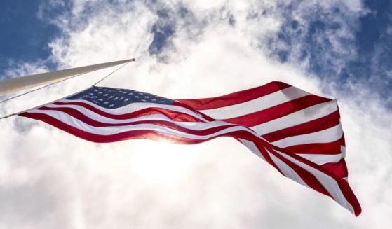 An American flag flies in the above stock image.