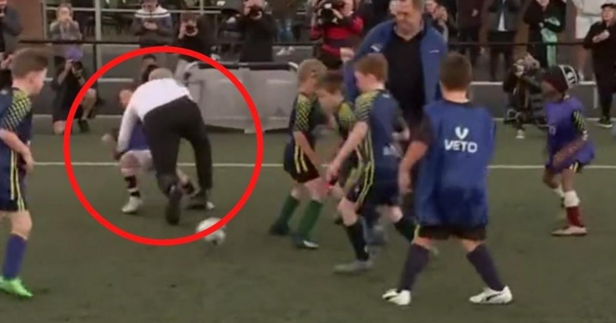 Australian Prime Minister Scott Morrison lost his balance and fell on a young soccer player Wednesday while taking part in a training match for players under age 8.