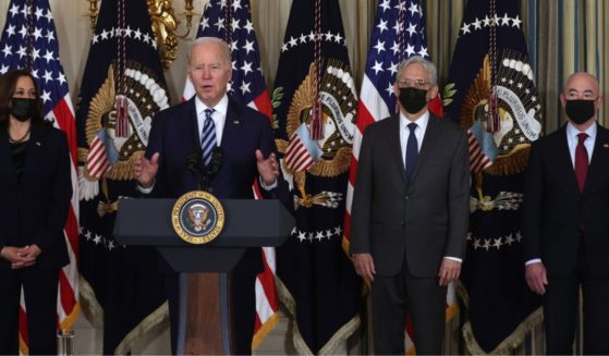 President Joe Biden speaks as, from left, Vice President Kamala Harris, Attorney General Merrick Garland and Secretary of Homeland Security Alejandro Mayorkas listen during a bill signing ceremony in the State Dining Room of the White House in Washington on Nov. 18.