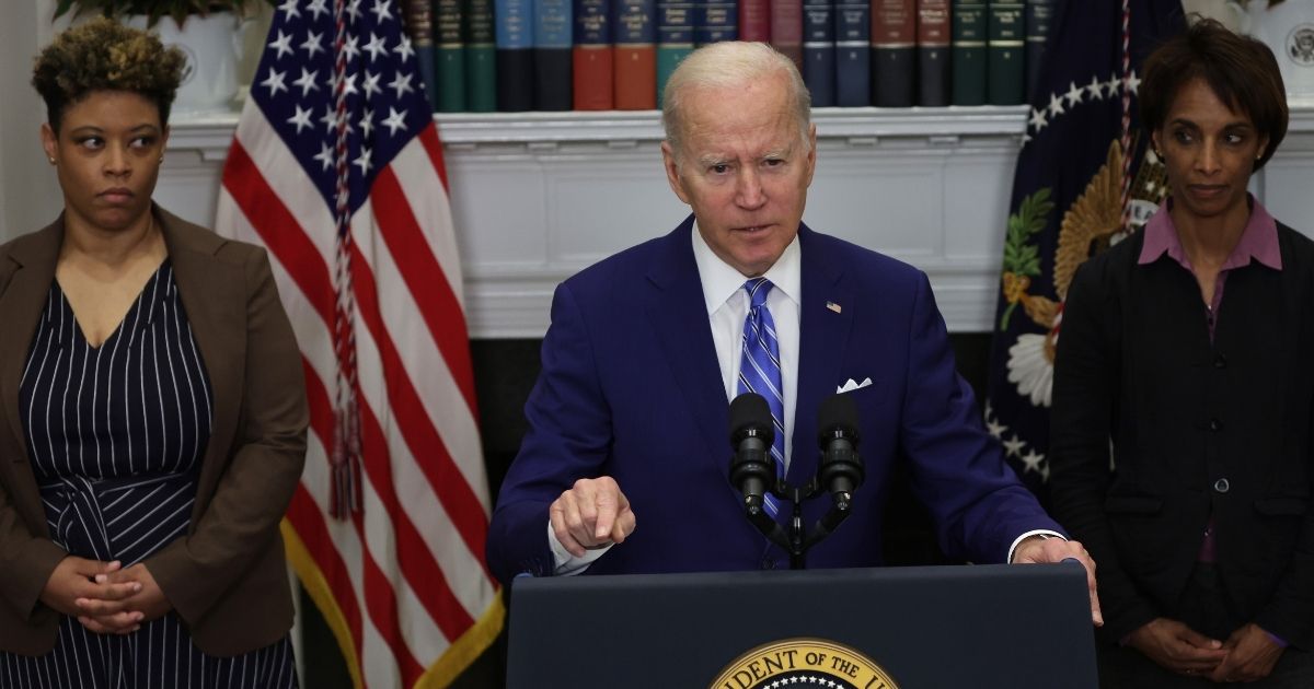 Director of the Office of Management and Budget Shalanda Young, left, and assistant to the president and chair of the Council of Economic Advisors Cecilia Rouse, right, watch as President Joe Biden delivers a speech from the Roosevelt Room of the White House on May 4.