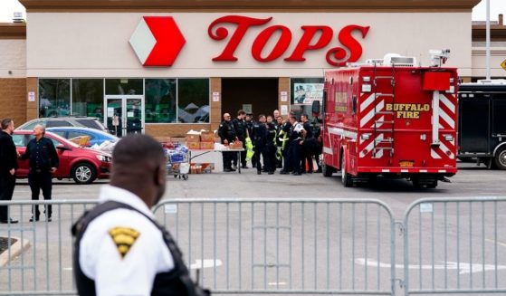 Investigators work the scene of a shooting at a supermarket in Buffalo, New York, on Monday.
