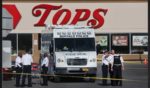 Police and FBI agents continue their investigation of Saturday's shooting at Tops market in Buffalo, New York. A gunman opened fire at the store, killing ten people and wounding another three.