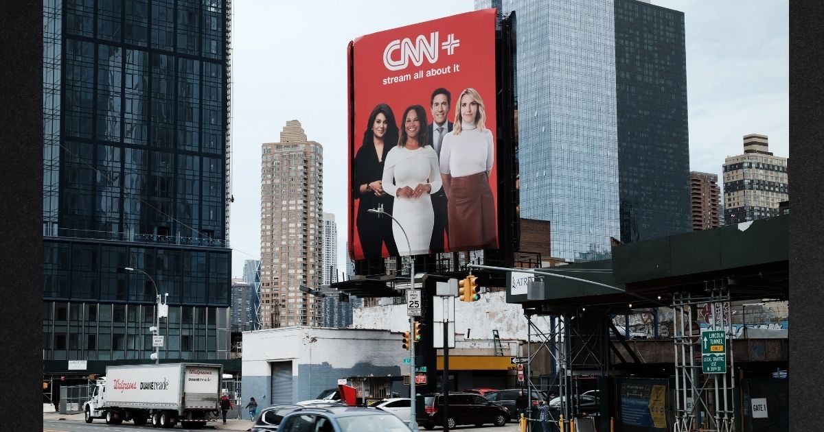 An advertisement for CNN+ is seen on display in New York City on April 21. Only three weeks after its launch, CNN abruptly shut down its new streaming service, laid off employees and quickly removed advertising and promotional material from public view.