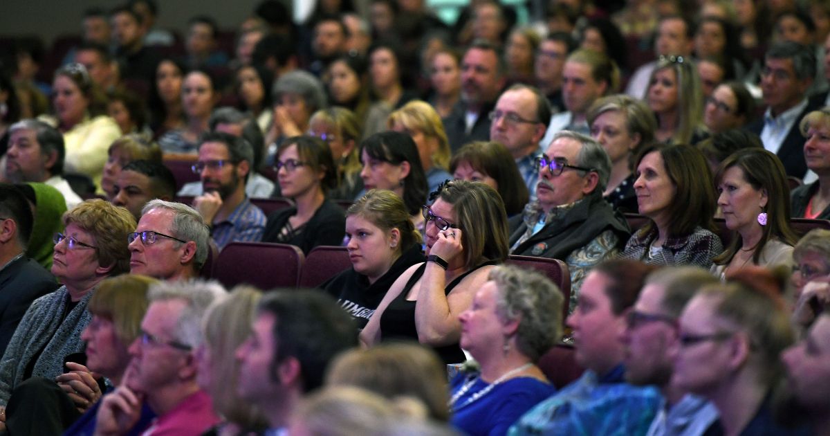 A crowd of church goers listens to the survivors speak during "Columbine 20 Years Later: A Faith-based Remembrance Service" for the victims of the Columbine High School shooting at Waterstone Community Church in Littleton, Colorado, on April 18, 2019.