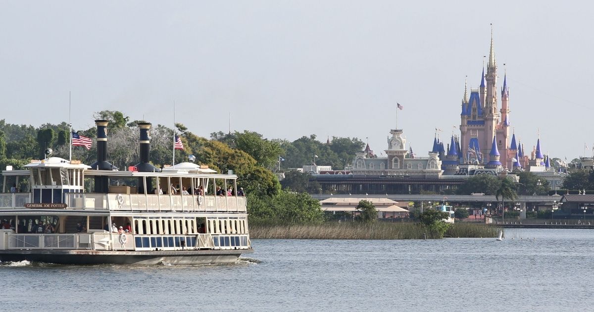 Disney's Magic Kingdom can be seen in the background as guests take a ferry to the theme park located in Orlando, Florida.