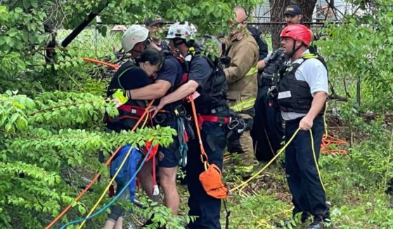 On Monday, a woman was in a water drainage flume when rainstorms caused the water levels to rise rapidly, threatening to carry the woman away in the swift current before fire crews came to her rescue.