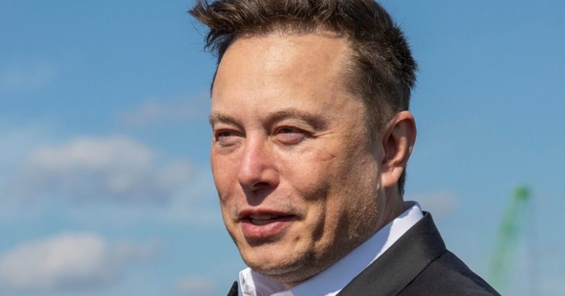 Elon Musk talks to reporters as he visits the construction site of the Tesla Gigafactory near Berlin on Sept. 3, 2020.