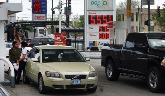 Customers purchase gas at a station in Chicago on May 10.
