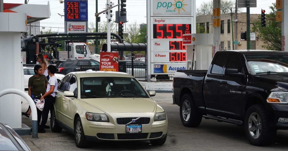 Customers purchase gas at a station in Chicago on May 10.