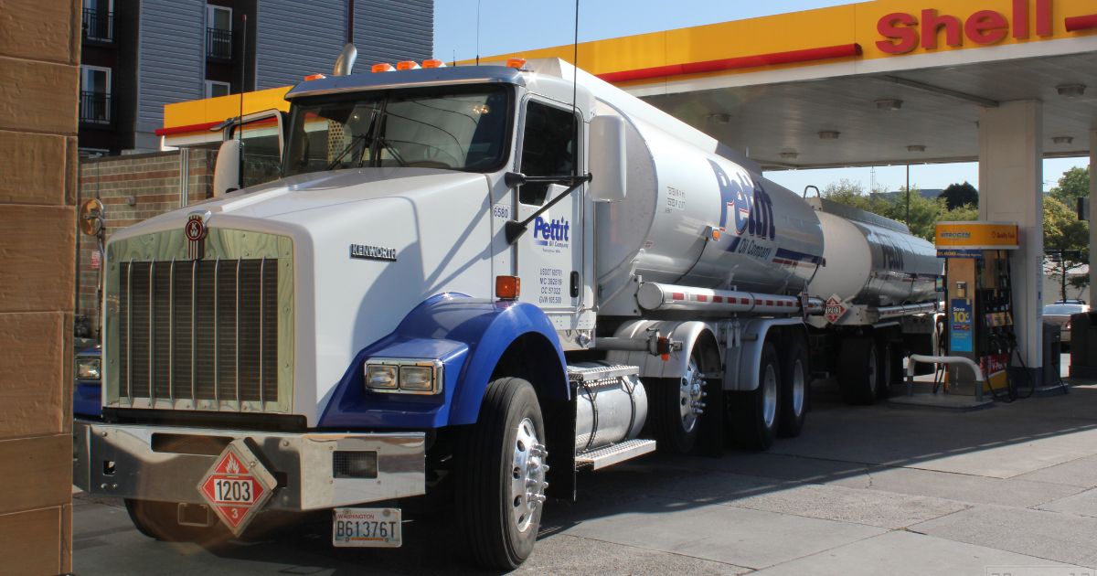 A semi-trailed is refueling at a Shell station.