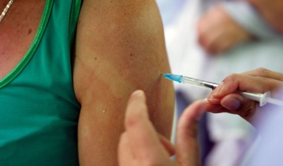 A woman is inoculated against COVID-19 with the Janssen vaccine on Nov. 10, 2021, in Medellin, Colombia.