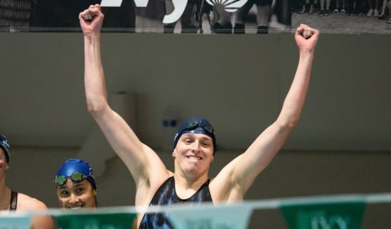 Lia Thomas, a man who identifies as a woman, celebrates the University of Pennsylvania women's swim team winning the 400-yard freestyle relay at the 2022 Ivy League Women's Swimming and Diving Championships in Cambridge, Massachusetts on Feb. 19.