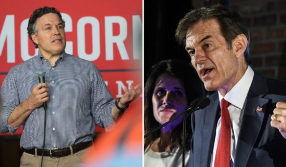 Republican U.S. Senate candidate Dave McCormick, left, speaks during a rally at Bloomsburg Area High School on Monday in Bloomsburg, Pennsylvania. Republican U.S. Senate candidate Mehmet Oz greets supporters on Tuesday in Newtown, Pennsylvania.