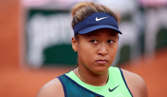 Former American Naomi Osaka, now a Japanese citizen, looks on against Amanda Anisimova of the United States Monday at the 2022 French Open in Paris.