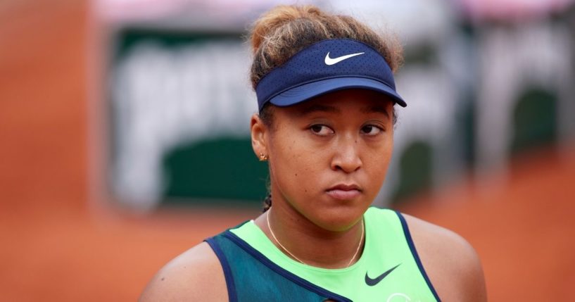 Former American Naomi Osaka, now a Japanese citizen, looks on against Amanda Anisimova of the United States Monday at the 2022 French Open in Paris.