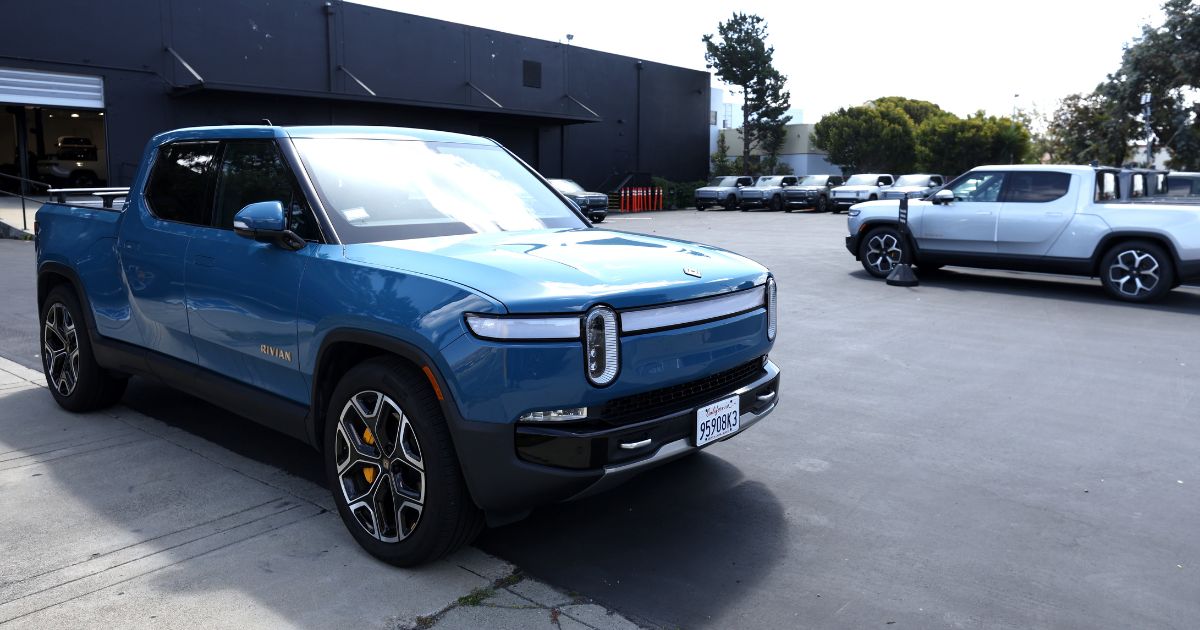 Vehicles are parked outside a Rivian service center in South San Francisco, California, on Monday.