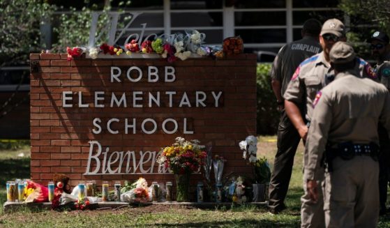 Flowers and candles outside Robb Elementary School in Uvalde, Texas