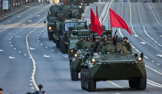 Military vehicles participate in a Victory Day parade rehearsal on Wednesday in Moscow.