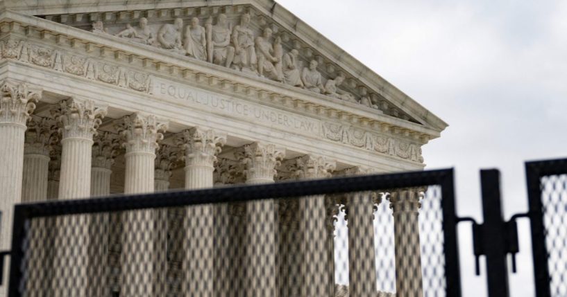A fence stands around the Supreme Court in Washington, D.C., on Thursday.