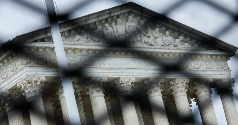 Protective fencing surrounds the U.S. Supreme Court on Tuesday in Washington, D.C.