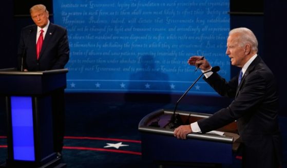 Then-Democratic presidential candidate Joe Biden, right, makes a point while then-President Donald Trump looks on during their debate at Belmont University in Nashville, Tennessee, on Oct. 22, 2020.