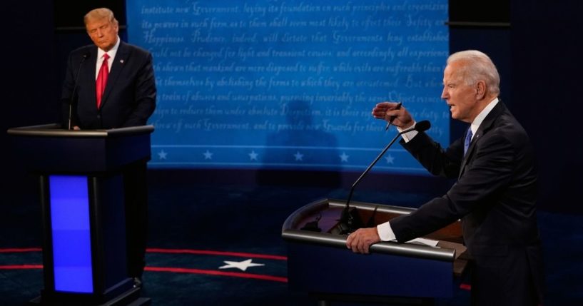 Then-Democratic presidential candidate Joe Biden, right, makes a point while then-President Donald Trump looks on during their debate at Belmont University in Nashville, Tennessee, on Oct. 22, 2020.