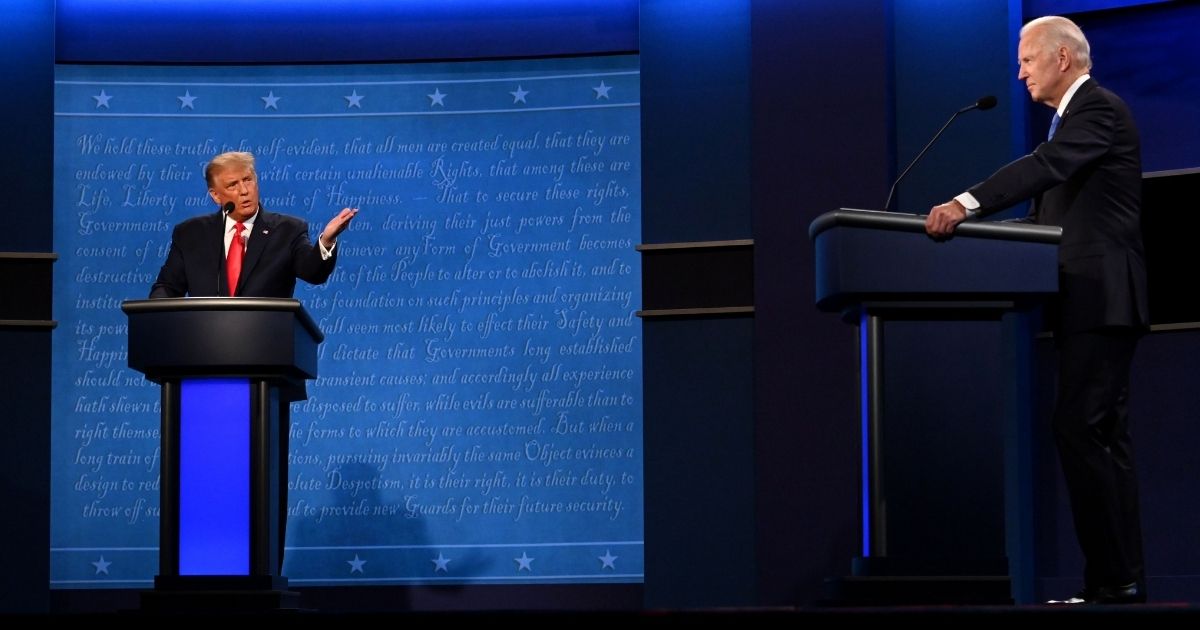 Then-President Donald Trump gestures toward Democratic rival Joe Biden during their debate at Belmont University in Nashville, Tennessee, on Oct. 22, 2020.