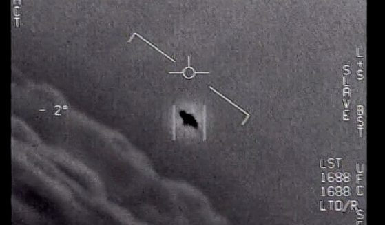 The Department of Defense released this image, labelled "Gimbal," of an unidentified flying object seen in the clouds, traveling against the wind, in 2015.