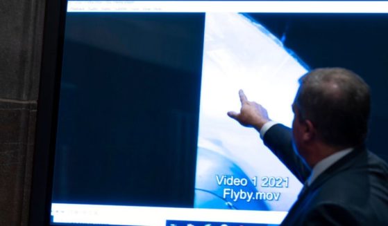 Deputy Director of Naval Intelligence Scott Bray points to a video display of an unidentified flying object during a subcommittee hearing on 'Unidentified Aerial Phenomena,' on Capitol Hill Tuesday.