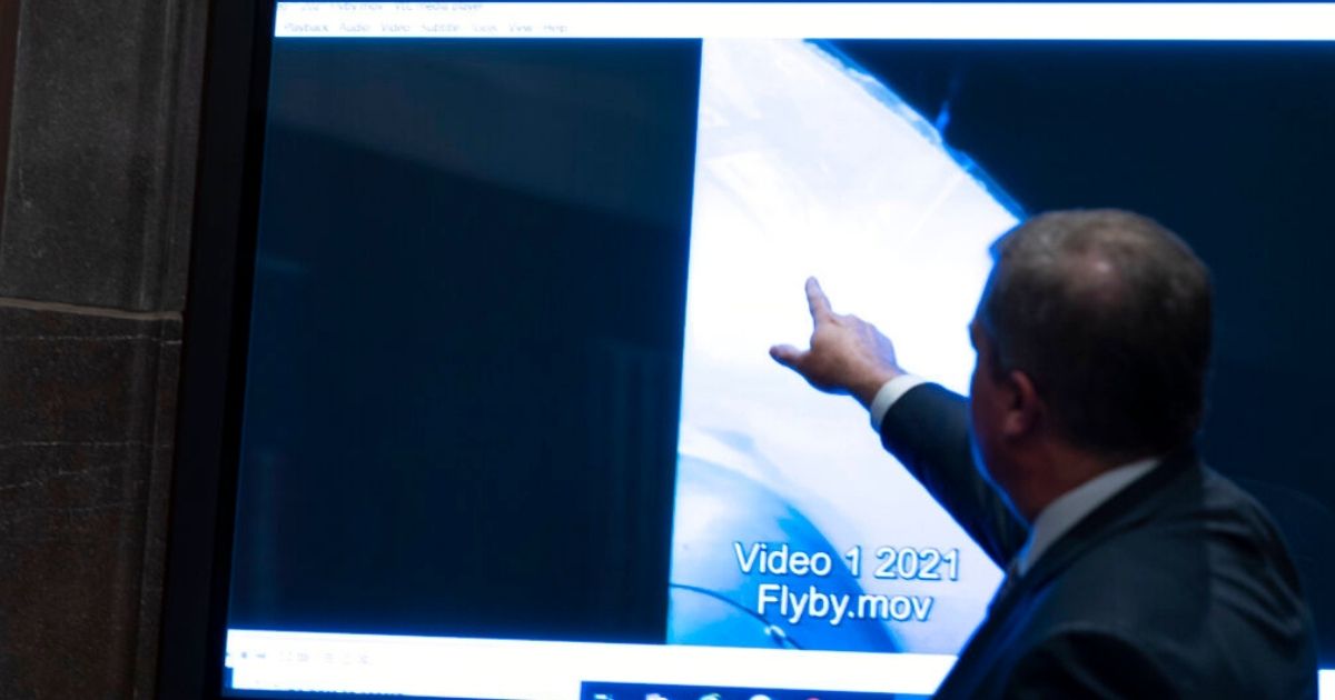 Deputy Director of Naval Intelligence Scott Bray points to a video display of an unidentified flying object during a subcommittee hearing on 'Unidentified Aerial Phenomena,' on Capitol Hill Tuesday.