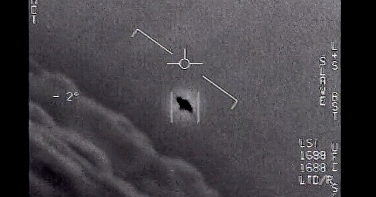 The Department of Defense released this image, labelled "Gimbal," of an unidentified flying object seen in the clouds, traveling against the wind, in 2015.