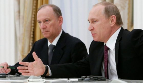Russian President Vladimir Putin, right, is pictured in a 2015 file photo with Russian Security Council Secretary Nikolai Patrushev at a meeting in Moscow.