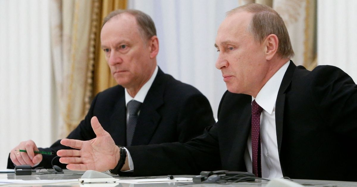 Russian President Vladimir Putin, right, is pictured in a 2015 file photo with Russian Security Council Secretary Nikolai Patrushev at a meeting in Moscow.
