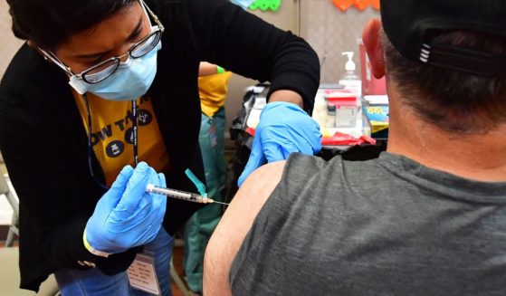 A nurse administers a COVID-19 vaccination from Pfizer during a clinic last week in Los Angeles.