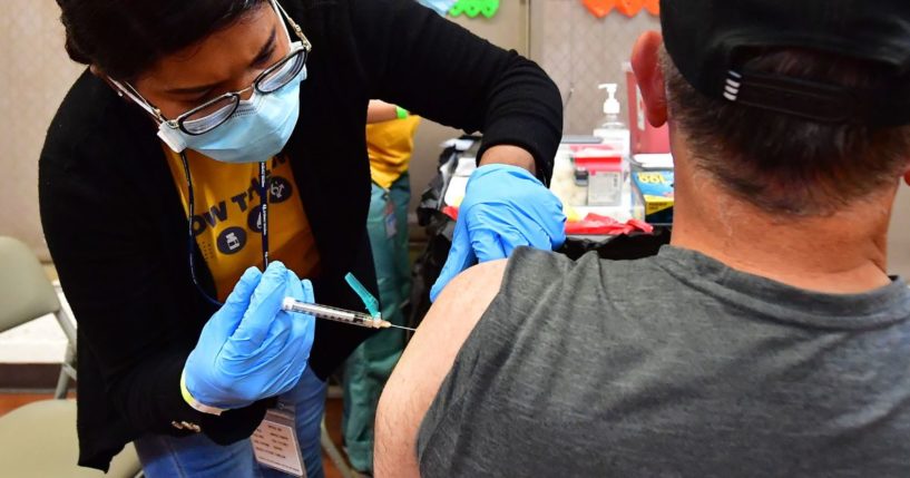 A nurse administers a COVID-19 vaccination from Pfizer during a clinic last week in Los Angeles.