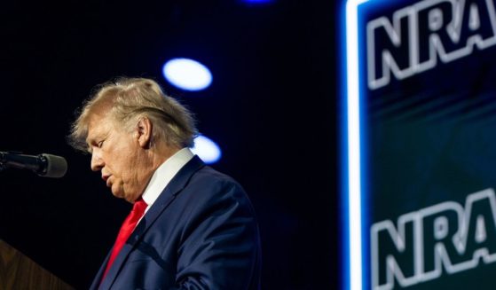 Former President Donald Trump reads the names of the victims in the Uvalde, Texas, mass shooting during the National Rifle Association annual convention Friday in Houston.