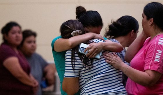 People mourn outside of the SSGT Willie de Leon Civic Center in Uvalde, Texas, following the mass shooting at Robb Elementary School on Tuesday.
