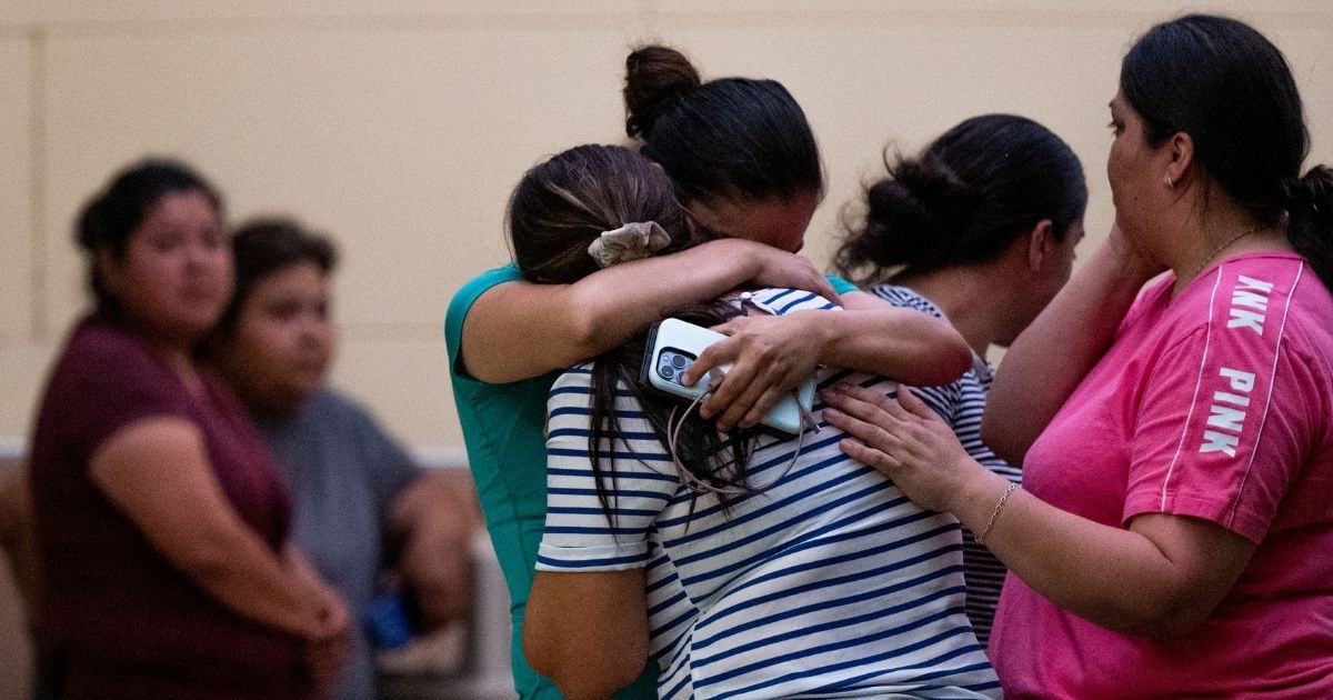 People mourn outside of the SSGT Willie de Leon Civic Center in Uvalde, Texas, following the mass shooting at Robb Elementary School on Tuesday.