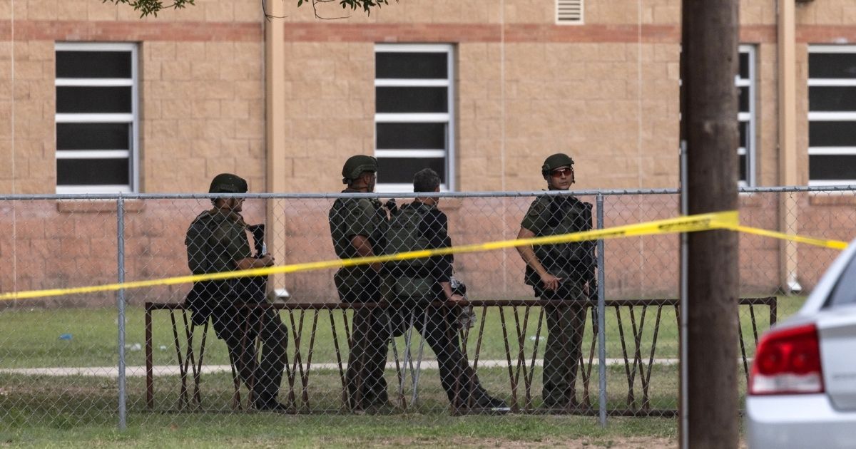 Law enforcement was outside the scene after the shooting at Robb Elementary School on Tuesday in Uvalde, Texas.