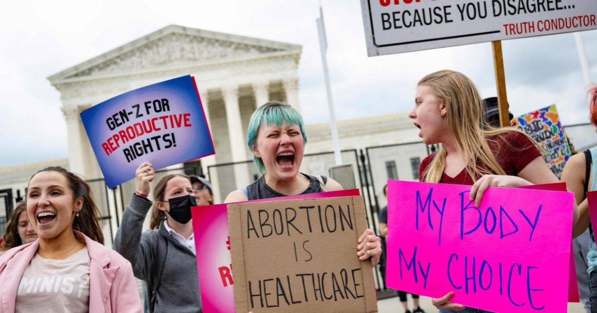 Pro-abortion demonstrators chant in front of the Supreme Court in Washington, D.C., on Thursday.