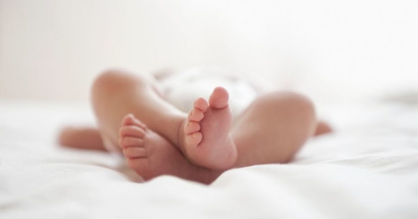 A newborn baby is seen in this stock image.