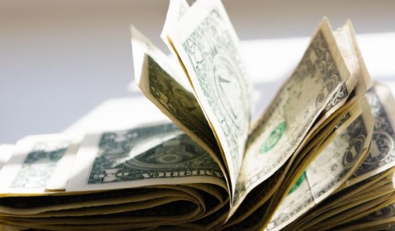 A wad of cash is seen in this stock image.