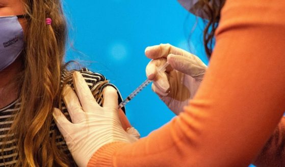 A girl receives the Pfizer-BioNTech COVID-19 vaccine at Hartford Hospital in Hartford, Connecticut, on Nov. 2, 2021.