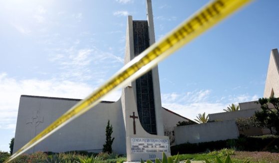 Police tape blocks off the scene of a shooting at Geneva Presbyterian Church on Sunday in Laguna Woods, California.