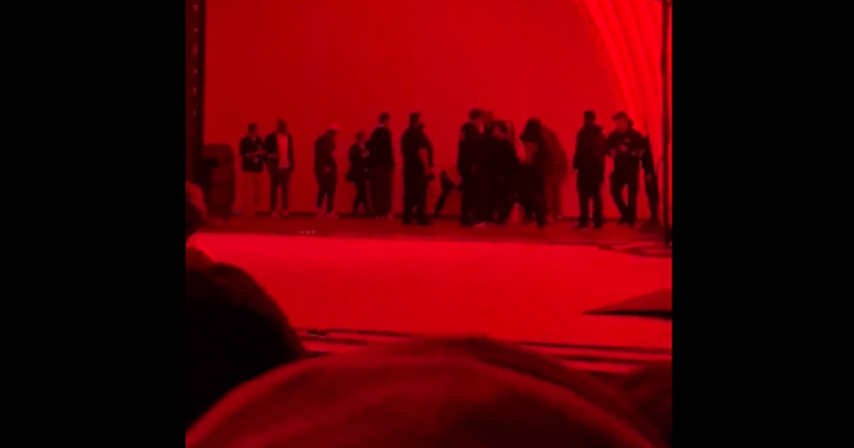 A screen shot from a video shows the melee on stage at the Hollywood Bowl on Tuesday after a man in the audience attacked comedian Dave Chappelle.