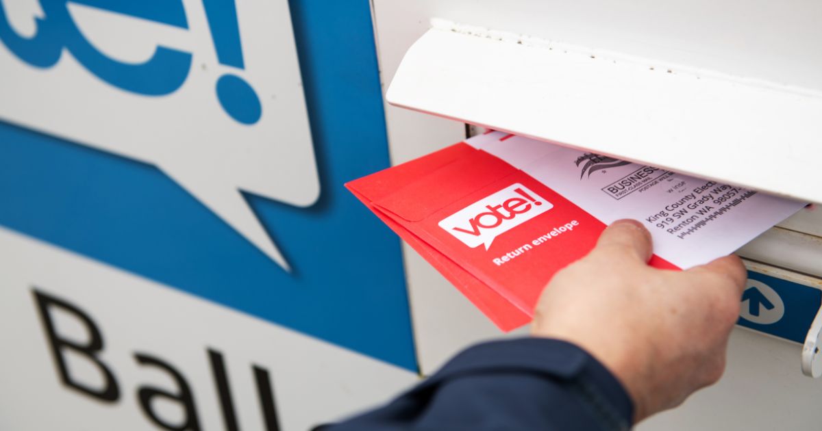 A stock photo shows ballots being placed into a drop box in Washington state on March 10, 2020.